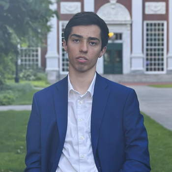 Ashkan Shafaei Photo Ashkan Shafaei posing in front of a brick building.