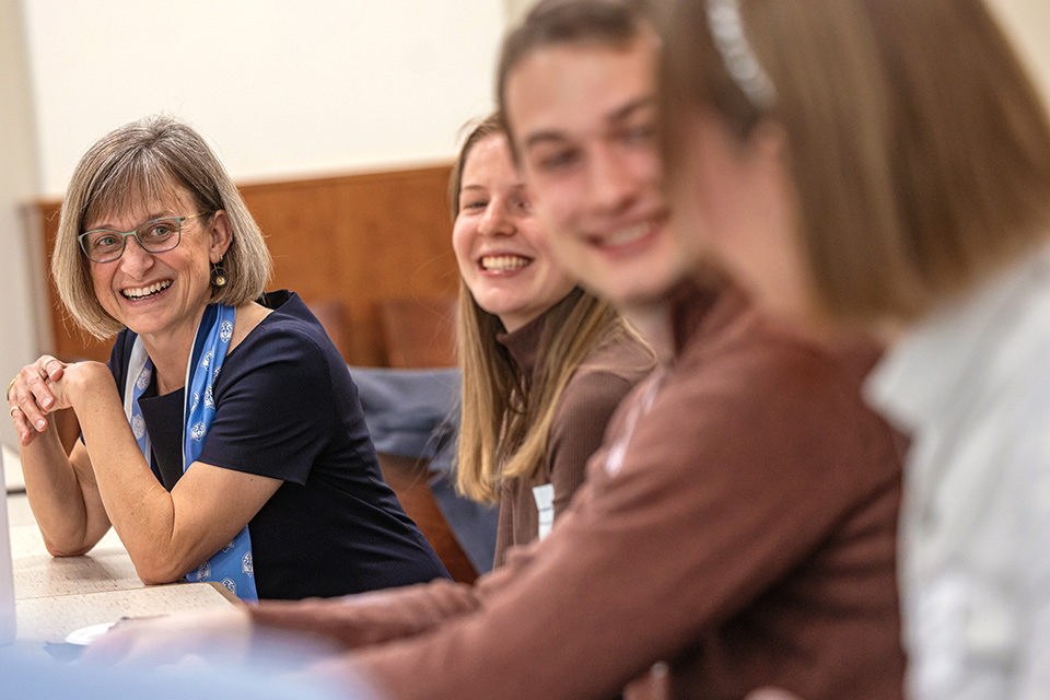 Meet First Lady Kathy Feser Kathy Feser laughs and chats with students at a table