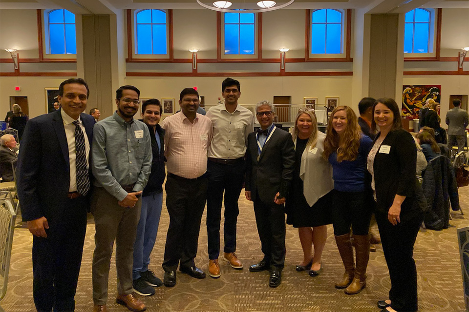 Group of fellows socializing at a conference