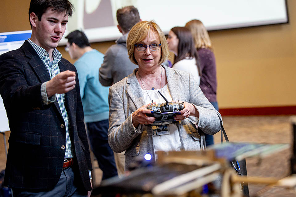 Marcus Klupar demonstrates his team’s project “Team MOMO – Autonomous Glider Payload Delivery” during the Senior Legacy Symposium on May 2, 2023. Photo by Sarah Conroy. 