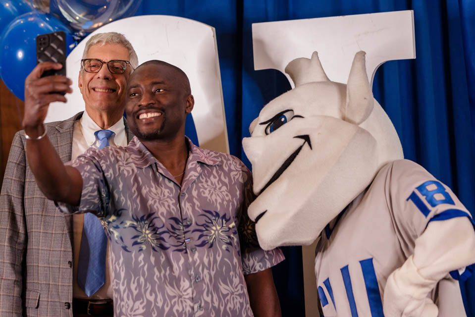 President Fred P. Pestello, Ph.D., takes a selfie with a student and the Billiken during the International Services President’s Reception on Monday, Sept. 18. Photo by Sarah Conroy. 