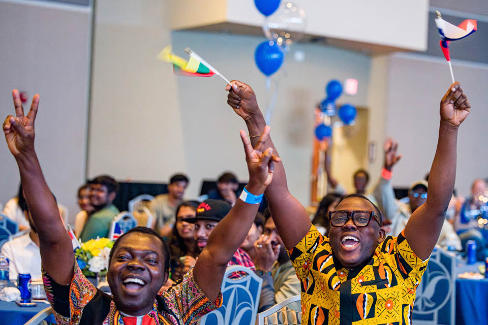 Students cheer during the fashion show as part of the International Services President’s Reception on Monday, Sept. 18. Photo by Sarah Conroy. 