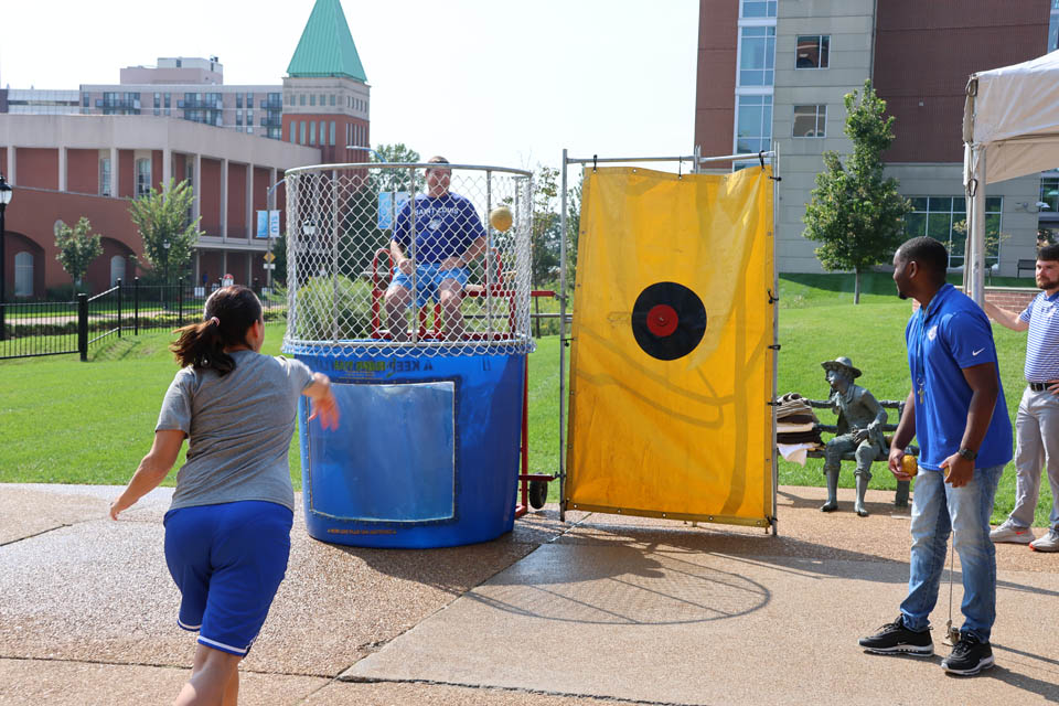 SLU women's basketball coach Rebecca Tillett attempted to sink men's basketball coach Travis Ford during an event Friday, Sept. 22. Photo by Joe Barker.  