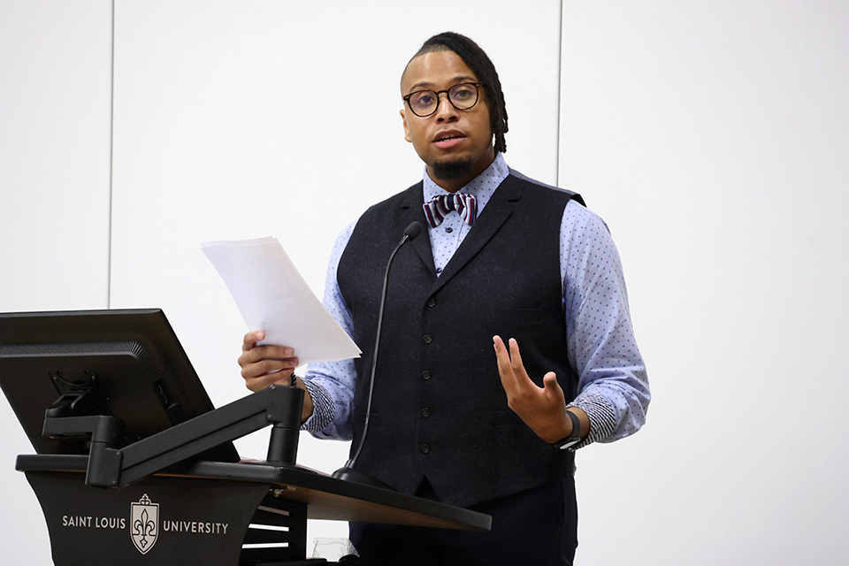 Aric Hamilton, Program Coordinator for Academic Affairs at the SLU School of Law, read a speech from Martin Luther King Jr. on Thursday, Oct. 12. Photo by Joe Barker.