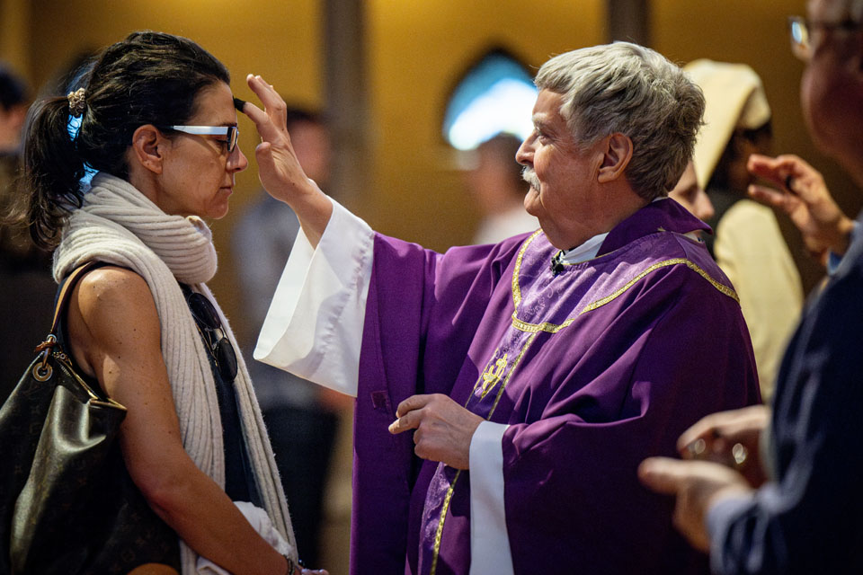 Members of the SLU community receive ashes during Ash Wednesday Mass at St. Francis Xavier College Church on  Wednesday, Feb. 14. Photo by Sarah Conroy.