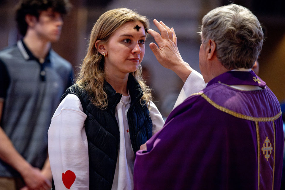 Members of the SLU community receive ashes during Ash Wednesday Mass at St. Francis Xavier College Church on  Wednesday, Feb. 14. Photo by Sarah Conroy.