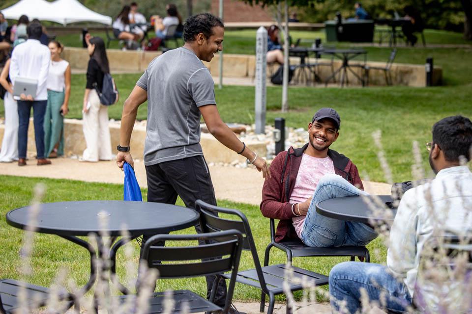 Friends greet each other on the first day of the fall semester on Tuesday, Aug. 21, 2024. Photo by Sarah Conroy. 