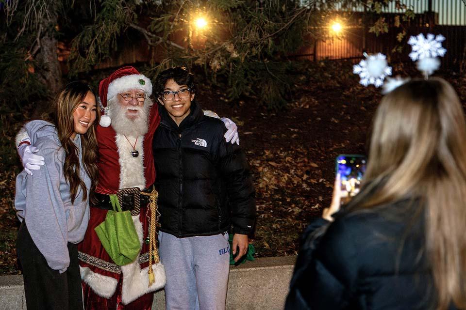 Christmas on the Quad attendees enjoy the festivities. Photo by Sarah Conroy.