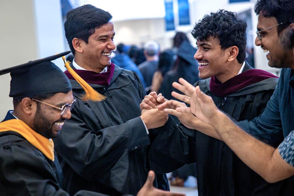 Graduates celebrate with friends after the Midyear Commencement on Saturday, Dec. 14, 2024. Photo by Sarah Conroy. 