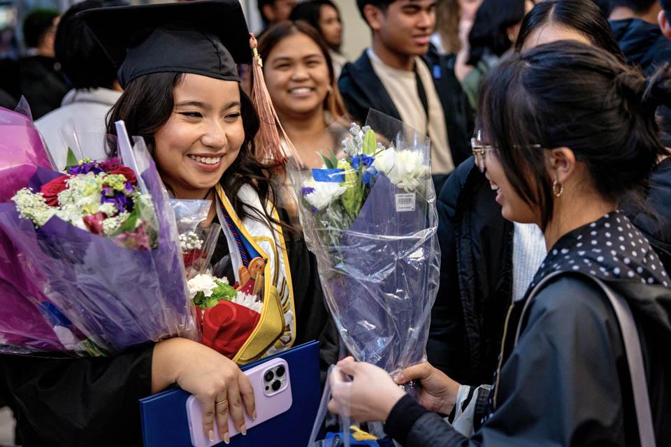 Graduates celebrate with family and friends after Midyear Commencement on Saturday, Dec. 14, 2024. Photo by Sarah Conroy. 