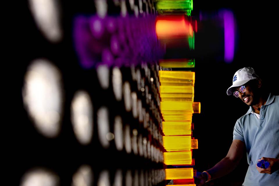 A student creates art on a giant Lite-Brite during the Billiken Block Party as part of Fall Welcome on Aug. 17, 2024. This photo won second place in the University Photographers Association monthly photo contest. Photo by Sarah Conroy. 