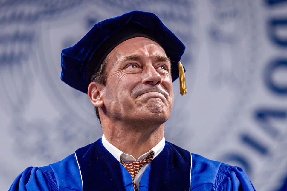 “Jon Hamm gets emotional while receiving an honorary degree at SLU’s Commencement Ceremony on May 18, 2024.  Photo by Sarah Conroy.