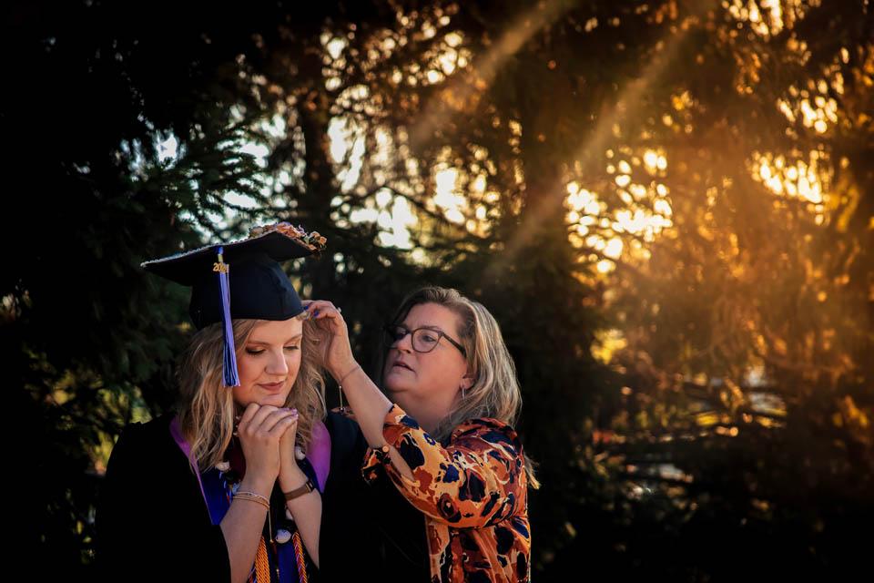 A graduate prepares for Commencement on May 18, 2024. Photo by Sarah Conroy. 