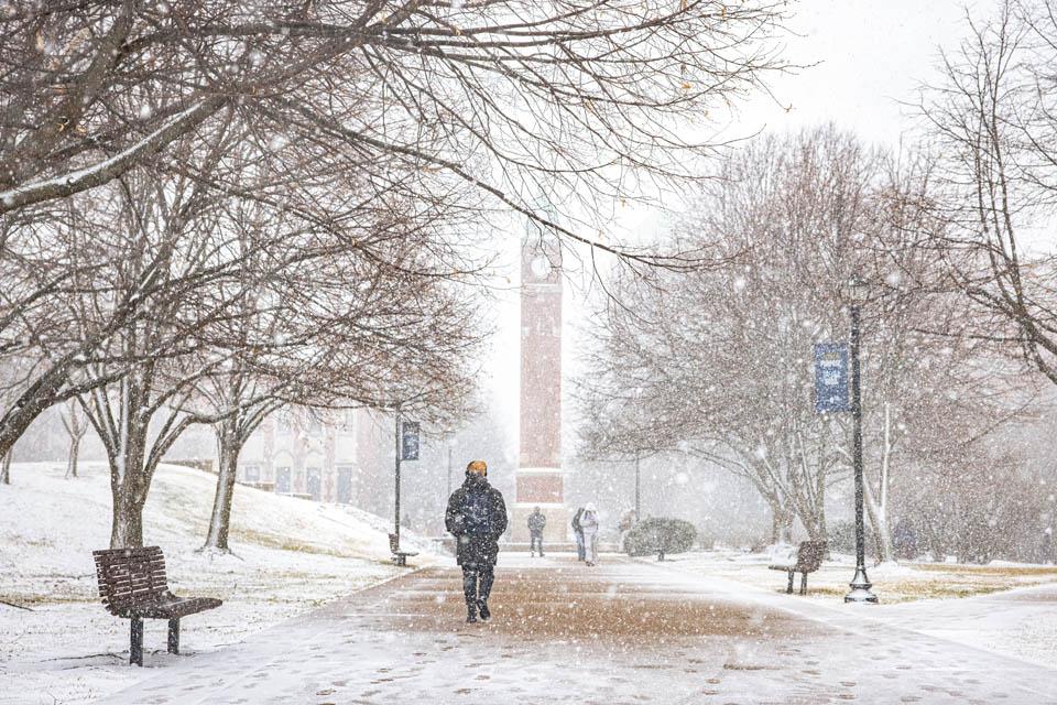 Students walk to class in the falling snow on Feb. 16, 2024. Photo by Sarah Conroy. 