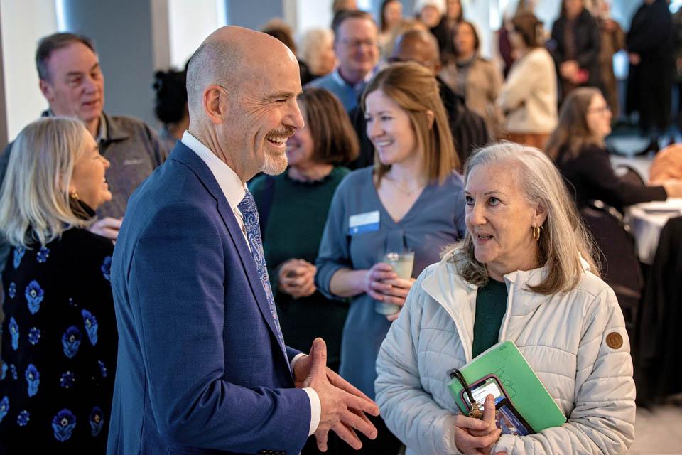 President-elect Edward Feser, Ph.D., meets members of faculty and staff during a reception at the Allied Health Building on Monday, Jan. 13, 2025. Photo by Sarah Conroy. 