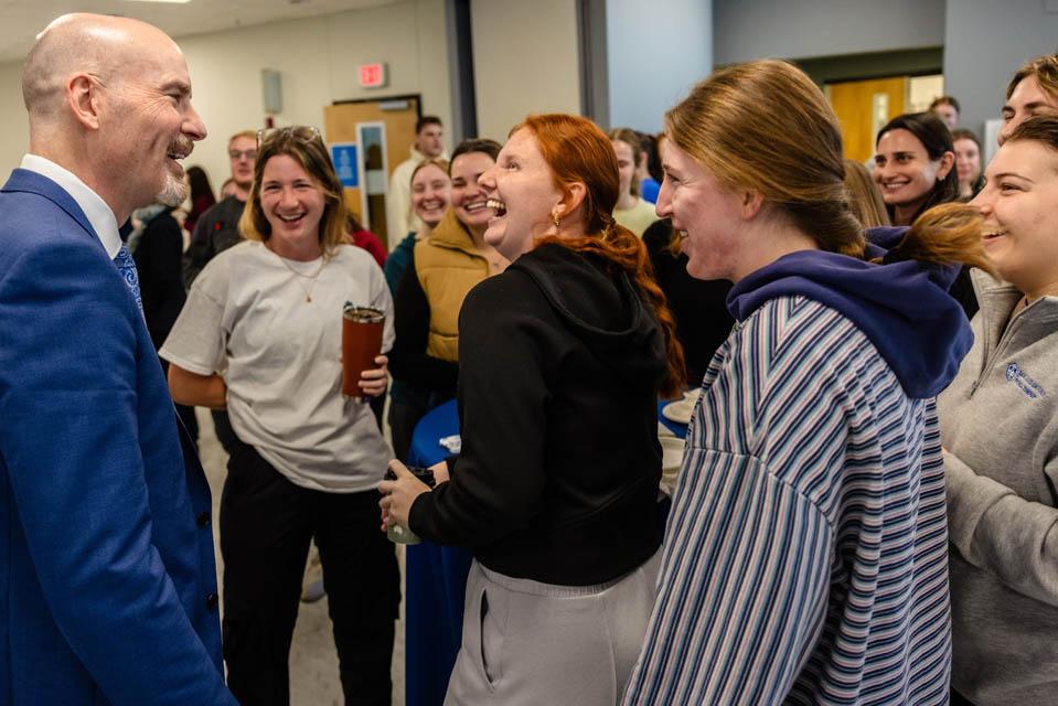 President-elect Edward Feser, Ph.D., meets students during a reception at the Allied Health Building on Monday, Jan. 13, 2025. Photo by Sarah Conroy. 