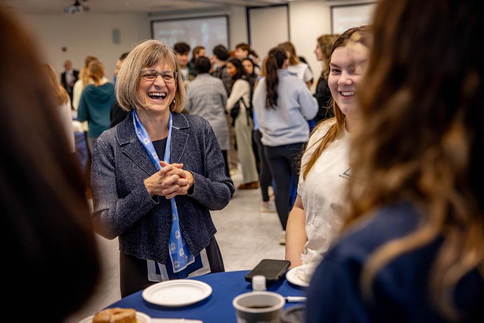 Kathy Feser meets members of faculty and staff during a reception at the Allied Health Building on Monday, Jan. 13, 2025. Photo by Sarah Conroy. 
