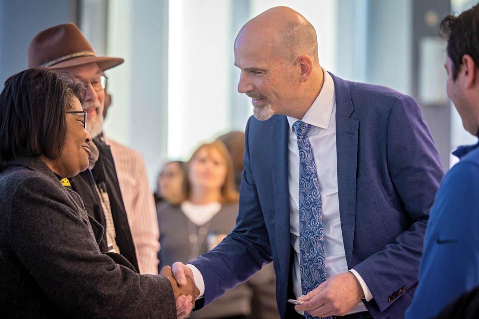 President-elect Edward Feser, Ph.D., meets students during a reception at the Allied Health Building on Monday, Jan. 13, 2025. Photo by Sarah Conroy. 