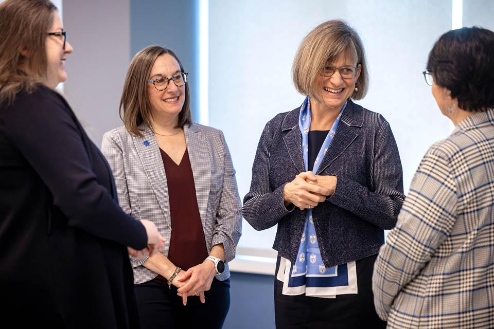 Kathy Feser meets members of faculty and staff during a reception at the Allied Health Building on Monday, Jan. 13, 2025. Photo by Sarah Conroy. 

