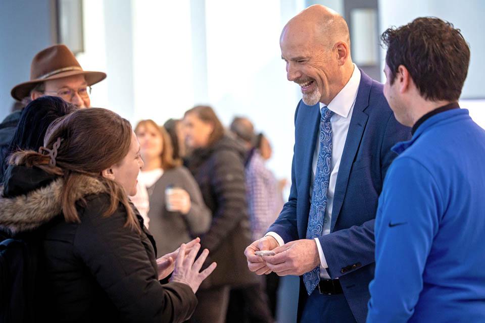 President-elect Edward Feser, Ph.D., meets members of faculty and staff during a reception at the Allied Health Building on Monday, Jan. 13, 2025. Photo by Sarah Conroy. 