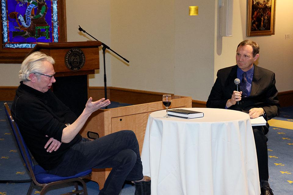 Jonathan Sawday, Ph.D., and chair of SLU's English Department, Brian Yothers, Ph.D., discuss Sawday's work at an event on Wednesday, Jan. 15.  Photo by Joe Barker.