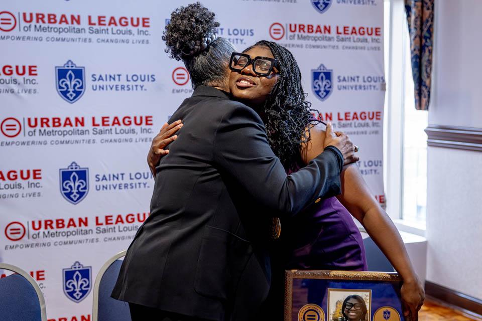 Regina Belle embraces Kaia S. Prichett following the Martin Luther King Jr. Memorial Tribute on Jan. 23, 2025. Photo by Sarah Conroy.