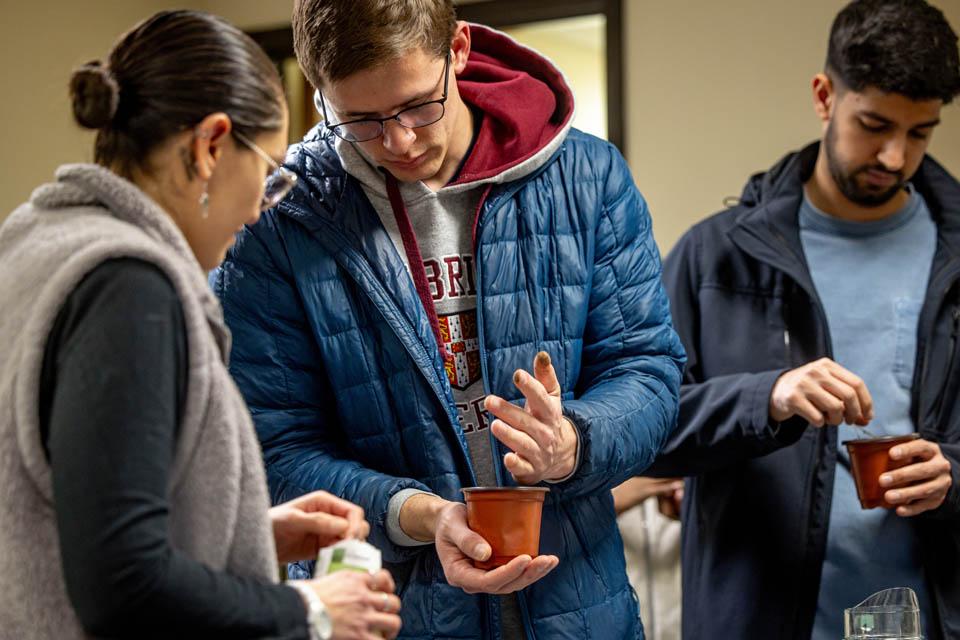 Students plant seeds during the Garden Wellness Series event for Wellness Day on Feb. 5, 2025. Photo by Sarah Conroy. 