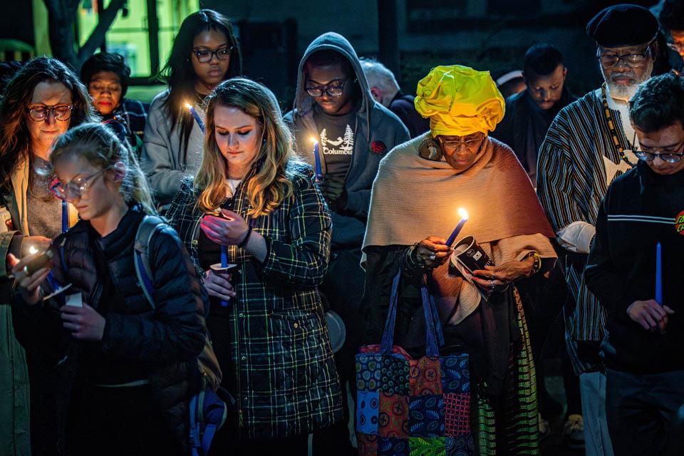 Attendees light candles during the Lights of Remembrance Candlelight Vigil on Thursday, Feb. 27, 2025. Photo by Sarah Conroy.