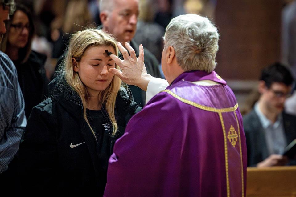 Members of the SLU community receive ashes during Ash Wednesday Mass at St. Francis Xavier College Church on March 5, 2025. Photo by Sarah Conroy. 