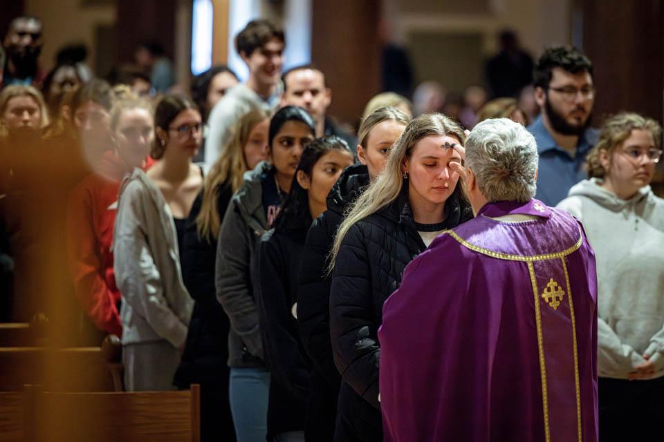 Members of the SLU community receive ashes during Ash Wednesday Mass at St. Francis Xavier College Church on March 5, 2025. Photo by Sarah Conroy. 