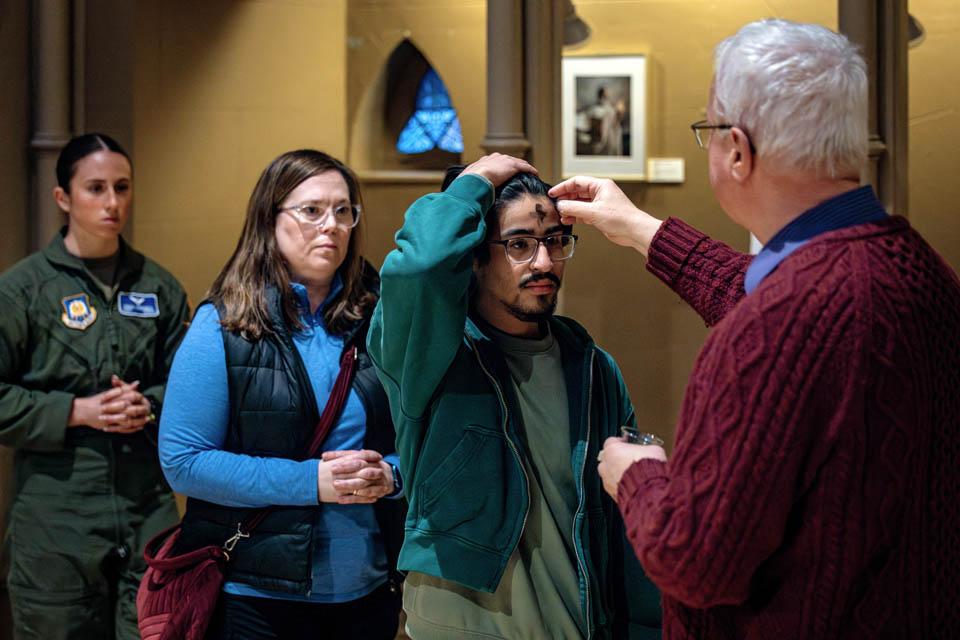 Members of the SLU community receive ashes during Ash Wednesday Mass at St. Francis Xavier College Church on March 5, 2025. Photo by Sarah Conroy. 