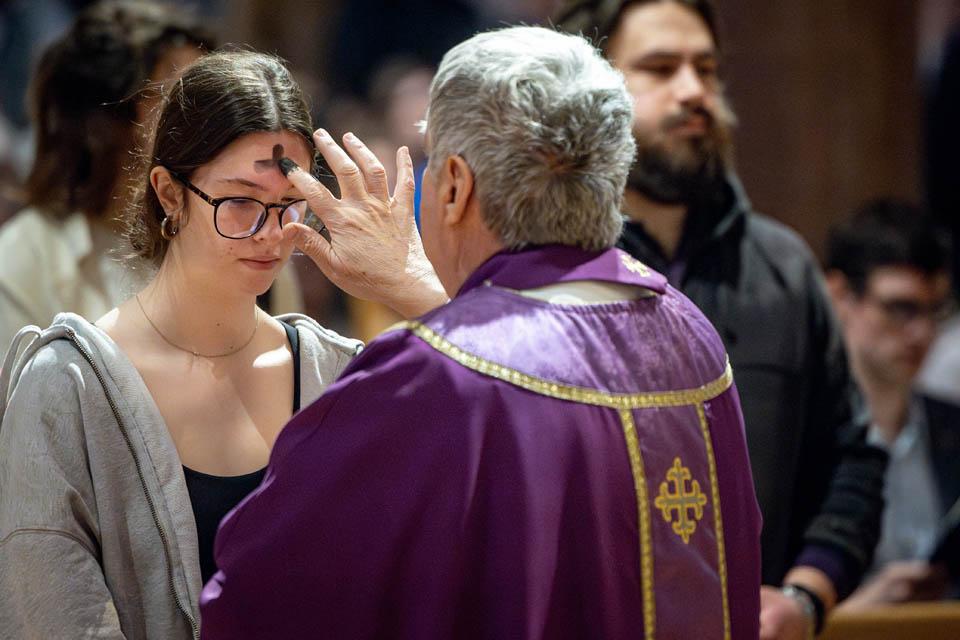 Members of the SLU community receive ashes during Ash Wednesday Mass at St. Francis Xavier College Church on March 5, 2025. Photo by Sarah Conroy. 