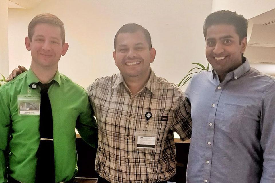 Three fellows celebrate their first day of their fellowship.