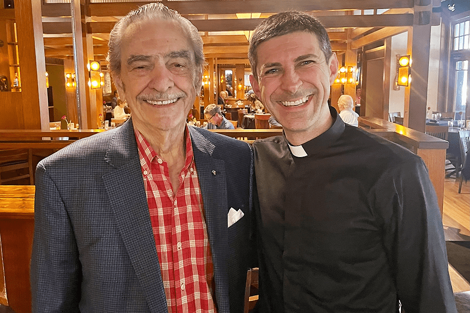 Al Hrubetz and Fr. Matthew Baugh, S.J. pose for a photo.