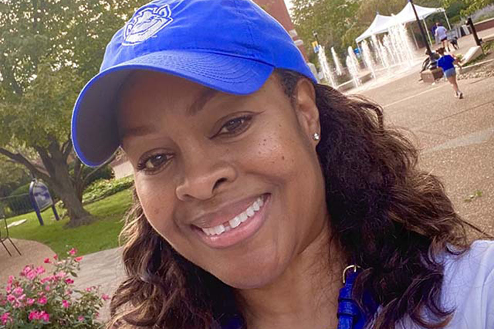 Lydia Pye Huston Lydia Pye Huston poses for a photo on campus with the clocktower behind her.