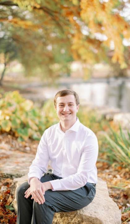 Wade Howdeshell sits outdoors to pose for a photo.