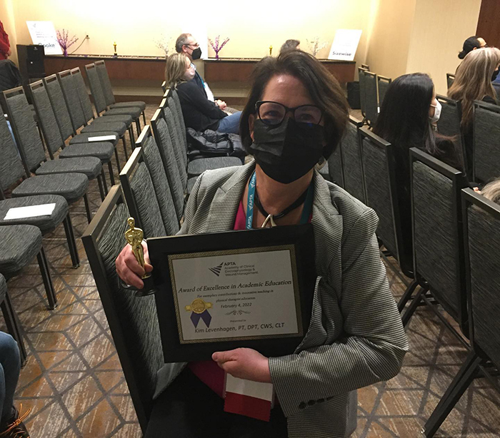 Dr. Levenhagen with her Award of Excellence