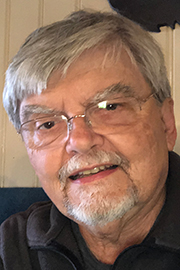 A headshot photo of Geoffrey Weiss.