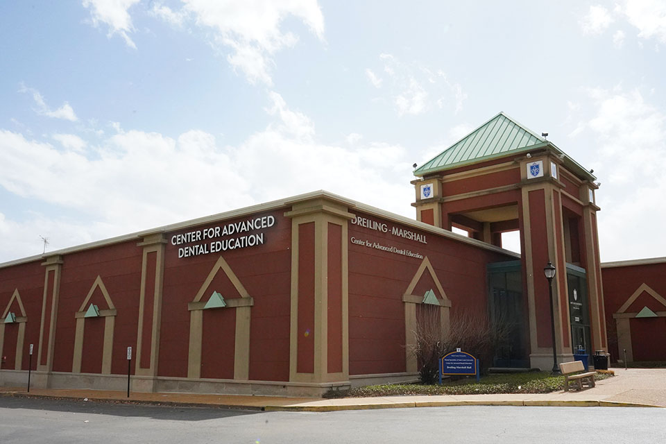 CADE A brick building says Center for Advanced Dental Education on the side.