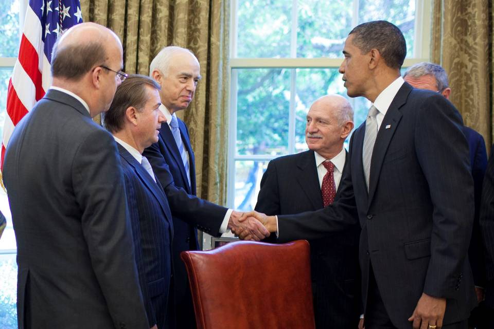 Amb. Michel shaking hands with former president Barack Obama