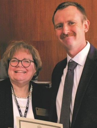 Peter Lucier and Mary Pay McInnis posing at the 2022 Excellence Award Ceremony