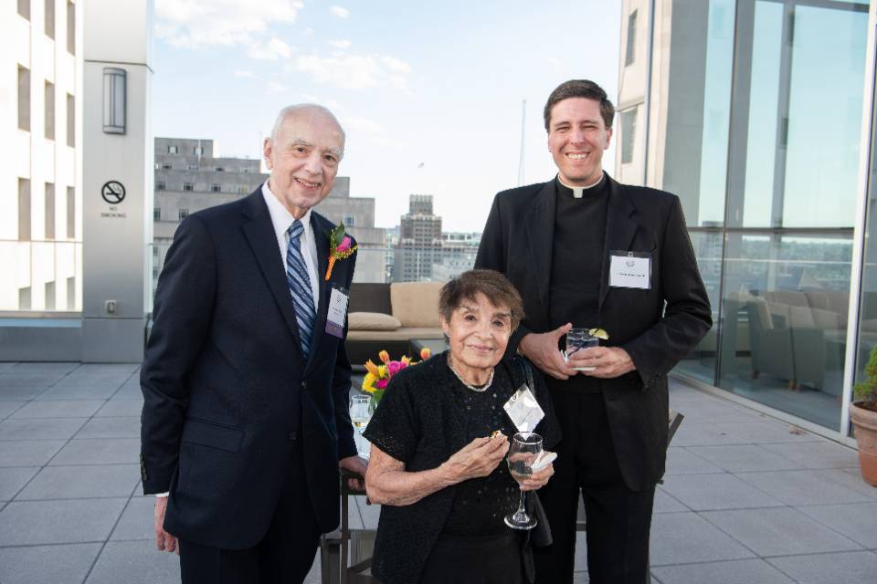 Amb. James Michel stands with wife, Conception Michel, and Fr. David J. Suwalsky, S.J., Ph.D.