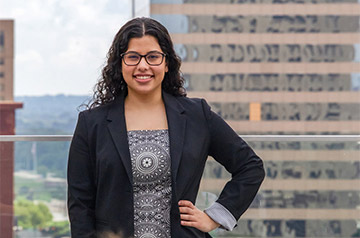 Third-year law student Hiba Al-Ramahi stands on SLU School of Law balcony