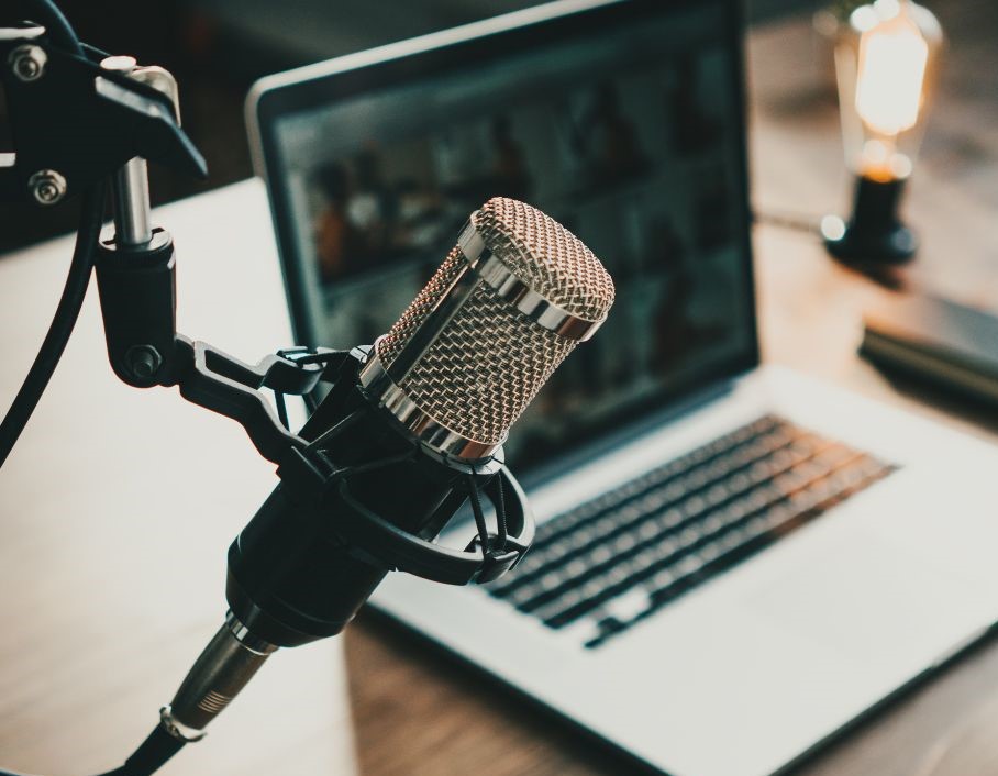 a photo of a microphone and a computer