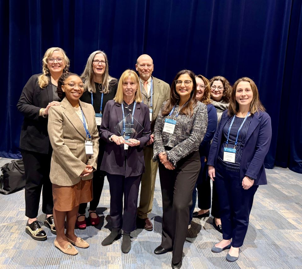 Sidney Watson holds her award with a group of health law professors at the annual AALS meetin