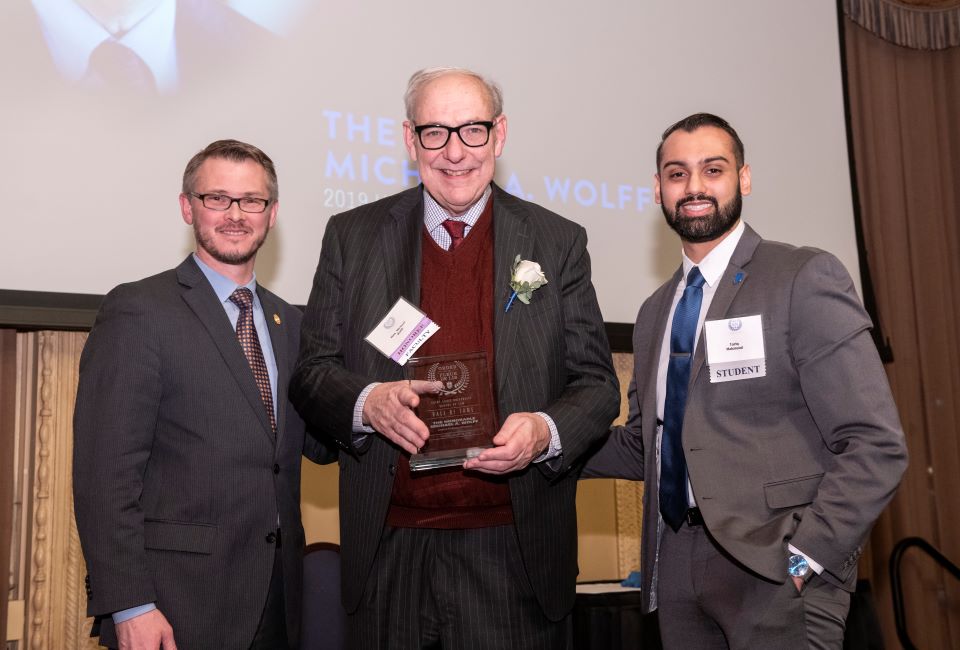 Michael Wolff receives the Order of the Fleur de Lis Award from Dean Bill Johnson.