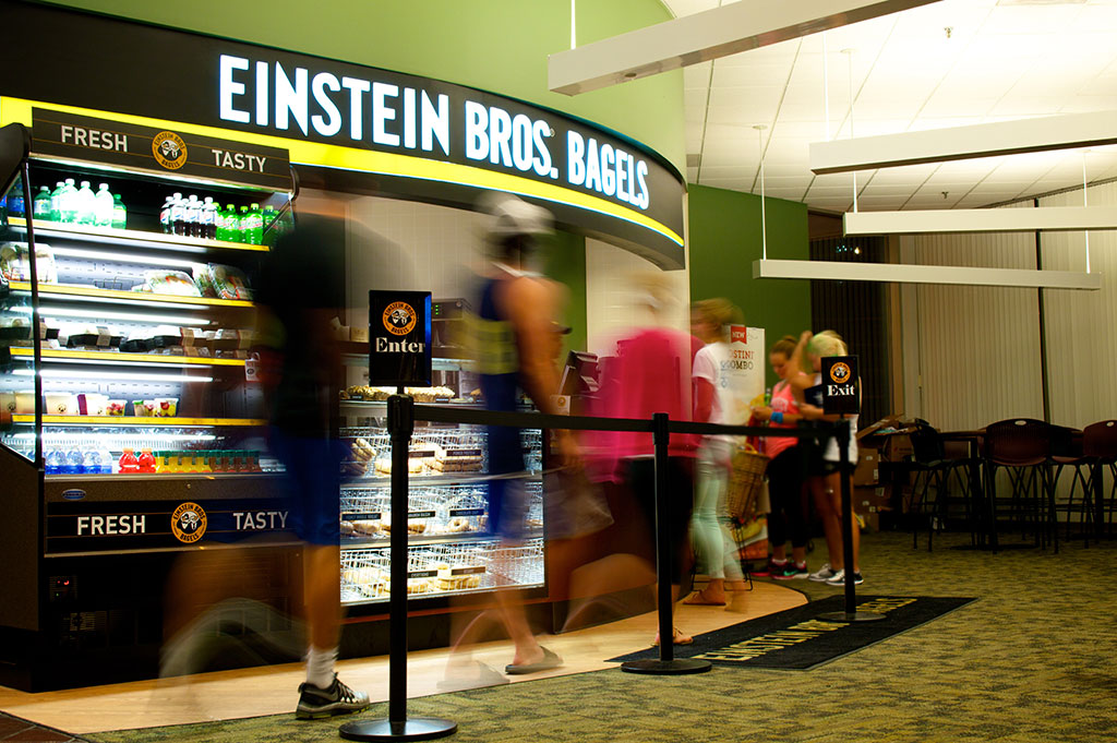 Students wait in line at Einstein Bros. Bagels in Pius XII Memorial Library