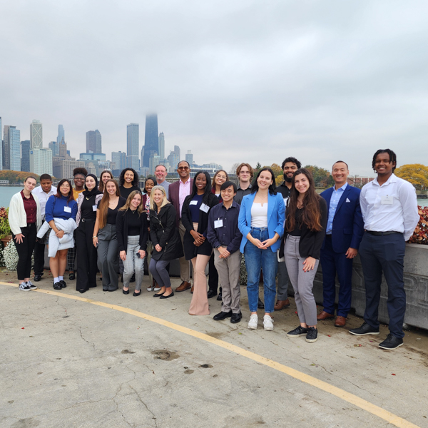 Students pose with the Chicago skyline in the background.