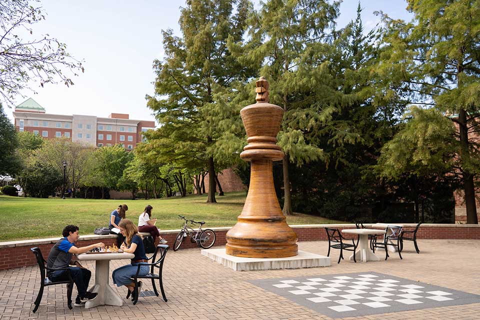 The Chess Team plays in front of Morrissey Hall.