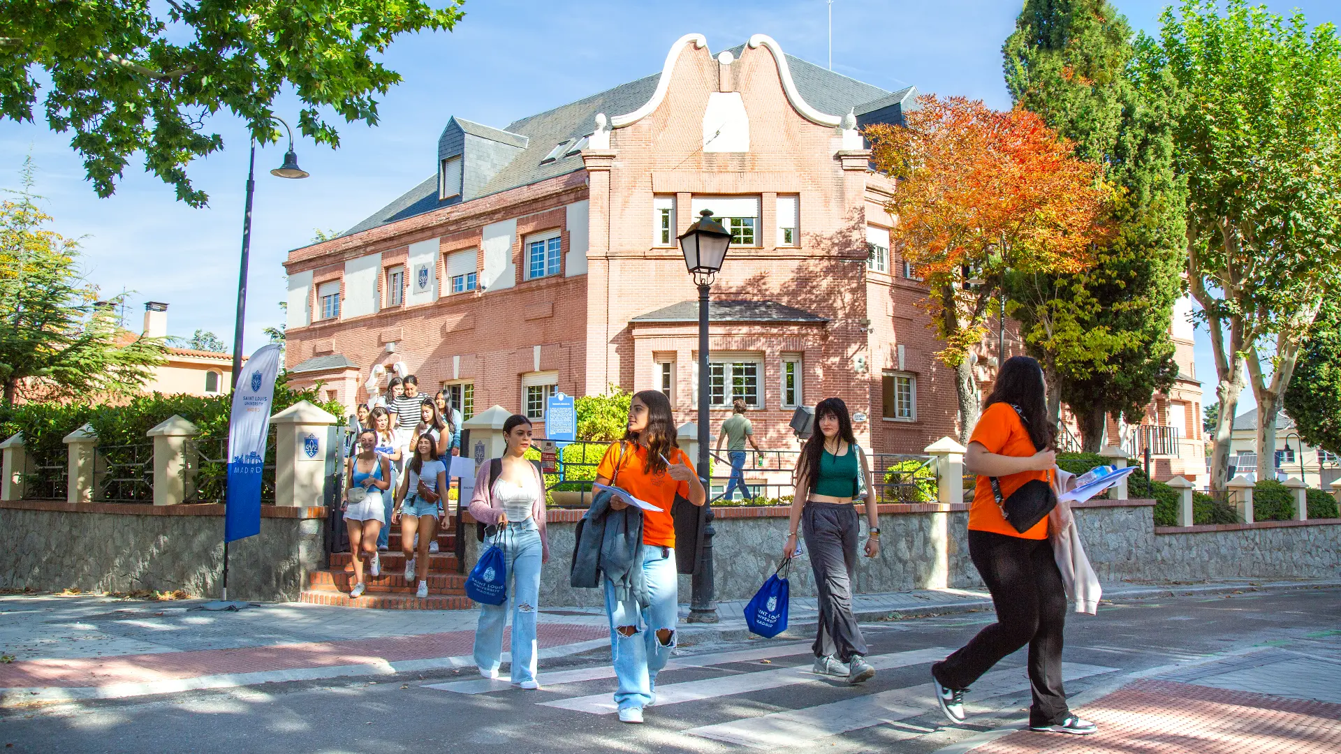 Students on orientation day are leaving Padre Arrupe Hall, one of the university's buildings, as they begin their journey at the university.